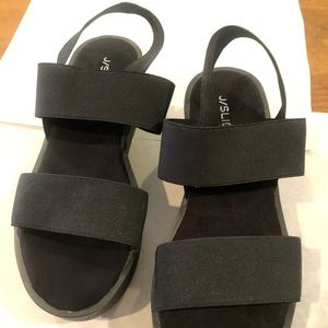 J/Slides platform sandals. Black elastic straps